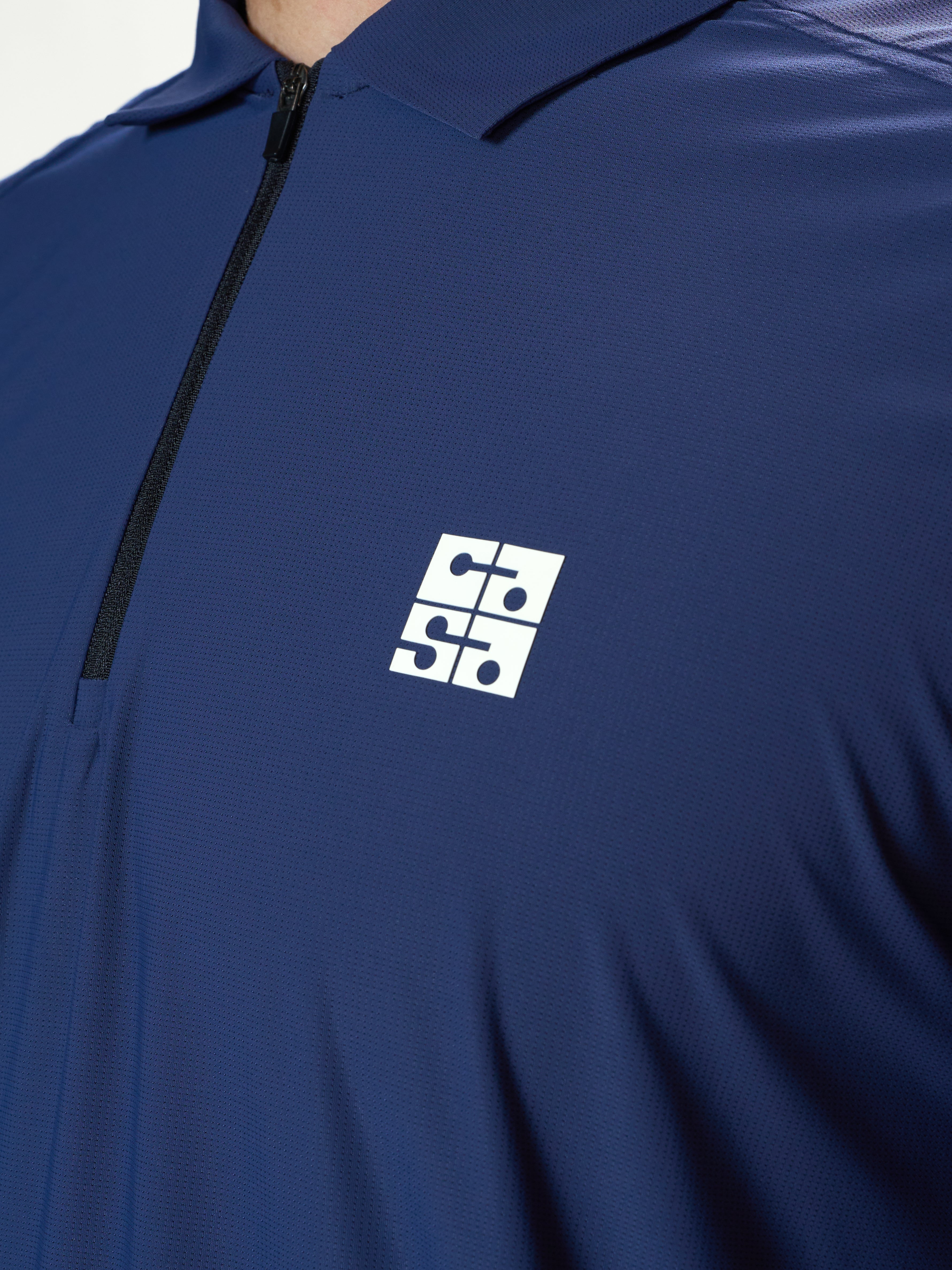 midnight strike zip polo
